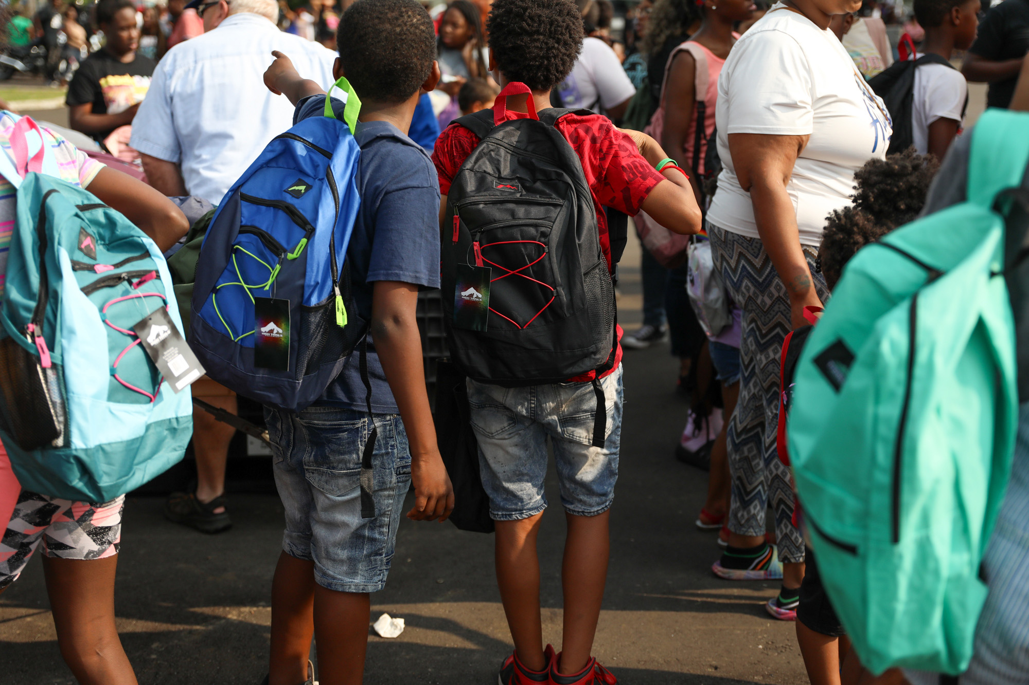 Photo of children wearing backpacks.
