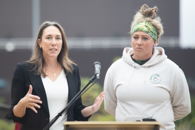 Two women standing behind a podium