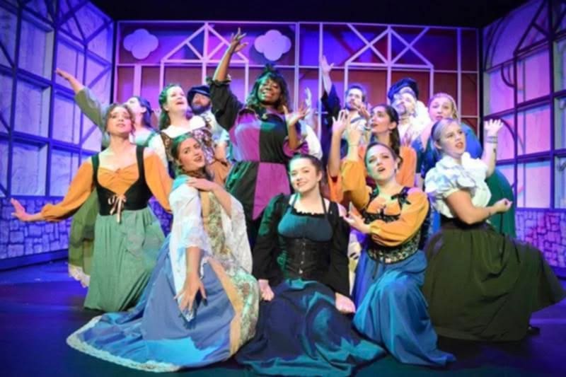 A group of actors on stage.