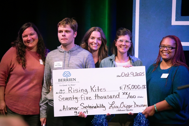 group photo with a large check.