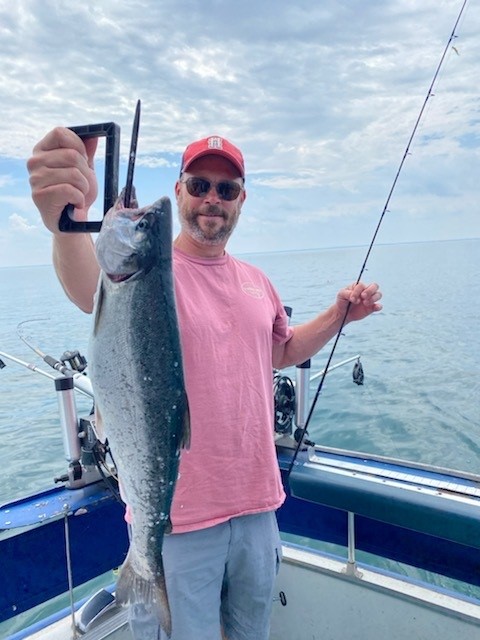 Man holding fish on boat