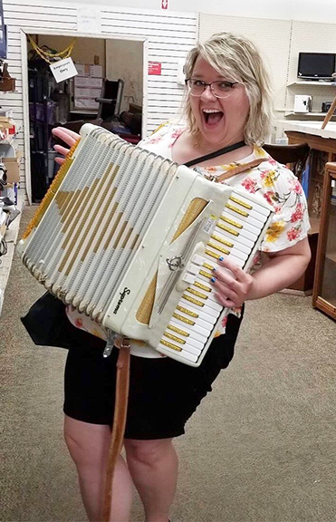 A woman playing the accordion.