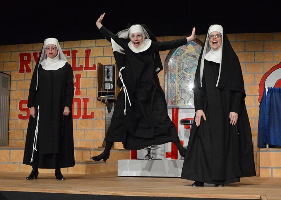 Three actresses dressed up as nuns.